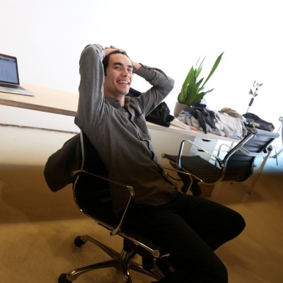 Justin Thompson seated in a studio workspace